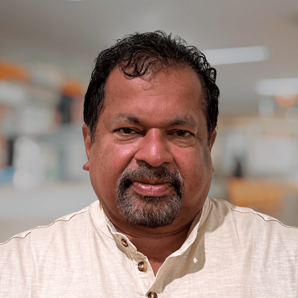 Thomas Mathew, East Coast Capital team member, professional headshot highlighting real estate and investment expertise.